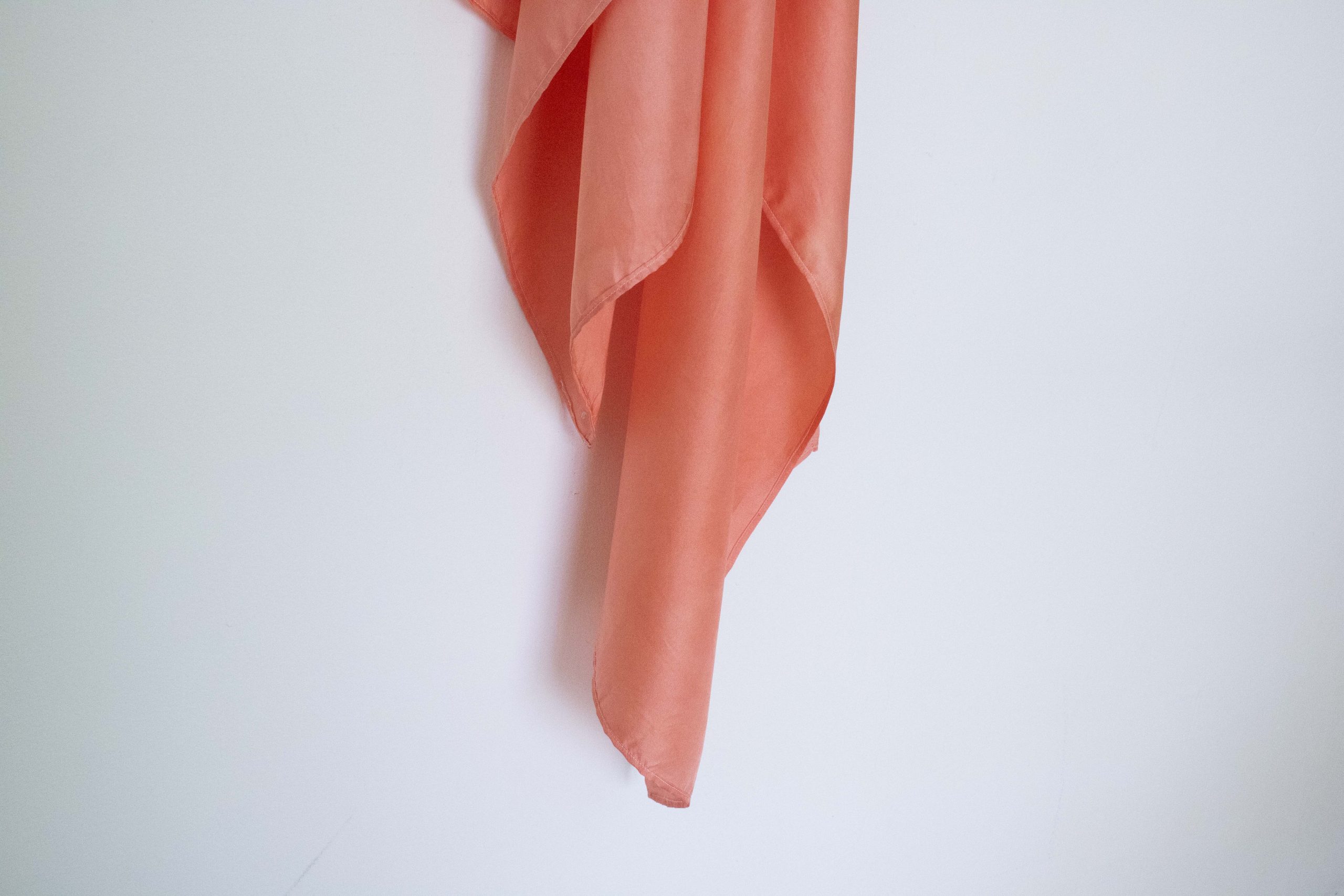 Hand-dyed silk scarf in sun coral tones, rectangle shape (150x50 cm), ideal as a Jewish head covering or tichel.
